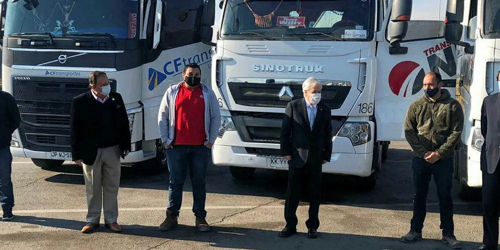 Before this latest incident Chilean President Sebastian Pinera (third right) met with truckers to unveil a bill aimed at protecting their vehicles from attack.