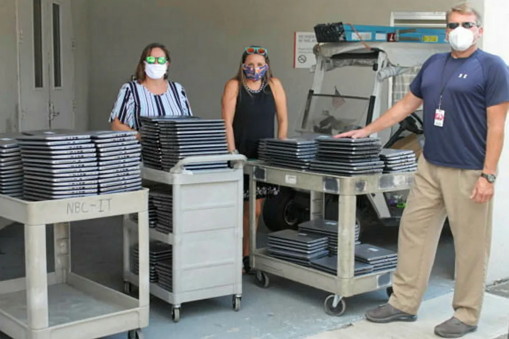 Donations: Halliburton hands out laptops and phones to help students with education in Houston