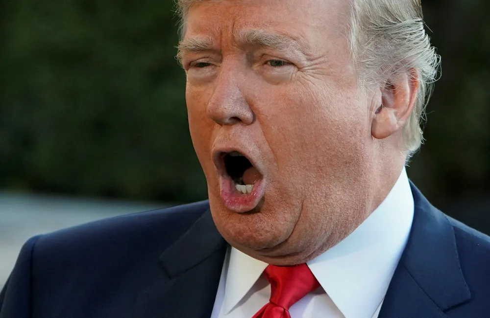 President Donald Trump jobber videre for å få godkjent innreiseforbudet til USA. Foto: Mandel Ngan/AFP photo/NTB scanpix