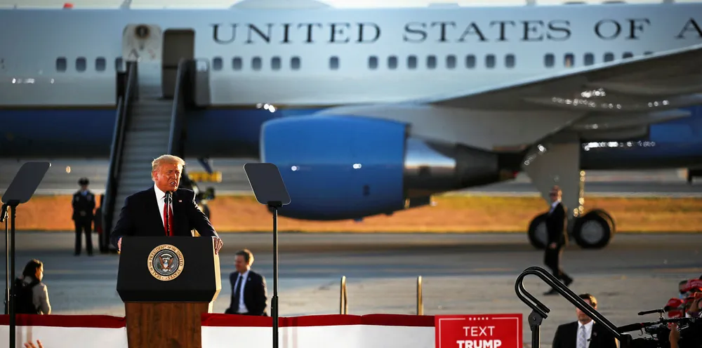 President Donald Trump speaks at a rally at an airport hanger in New Hampshire.