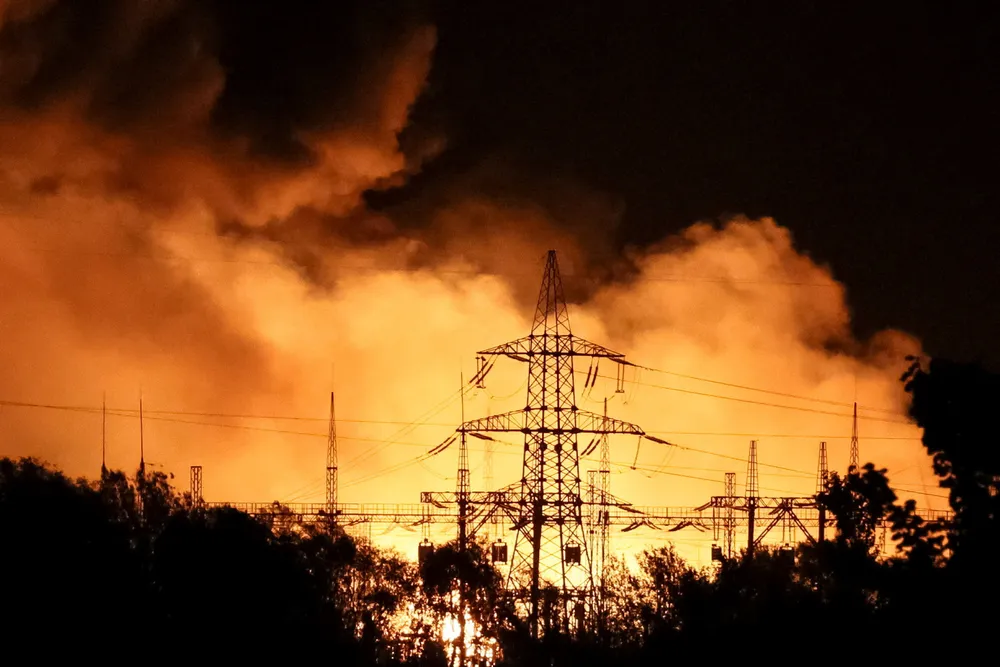 Escalation: A fire raging at the heat and power plant TETS-5 in Kharkiv in northern Ukraine after it was hit by a Russian missile on 11 September.