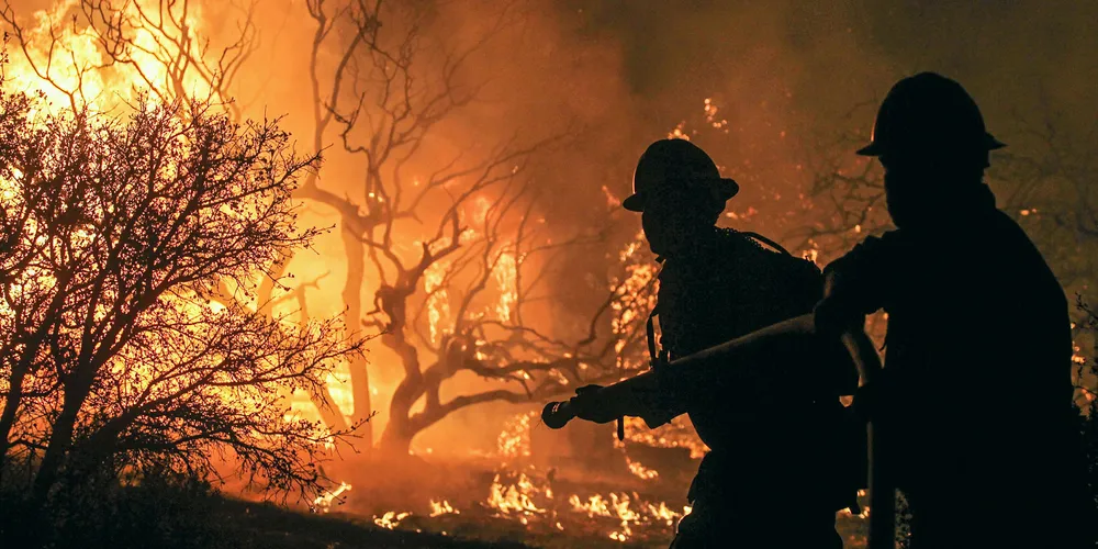 Firefighters tackle a wildfire in California.