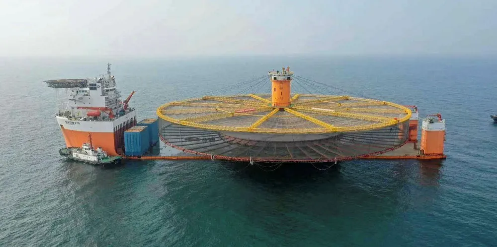 DeMaas's construction is towed into position in the East China Sea.