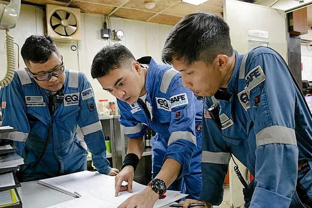 Teamwork: EnQuest workers offshore Malaysia