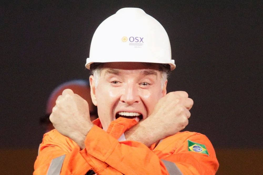 No cause for celebration: Brazilian former billionaire Eike Batista during his glory days cheering with his arms crossed in the shape of an "X" - the trademark of his once mighty empire