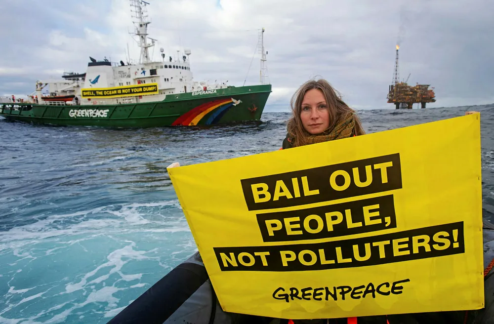Climate action: Greenpeace activist Jennifer Ganster with Brent Charlie platform in the background