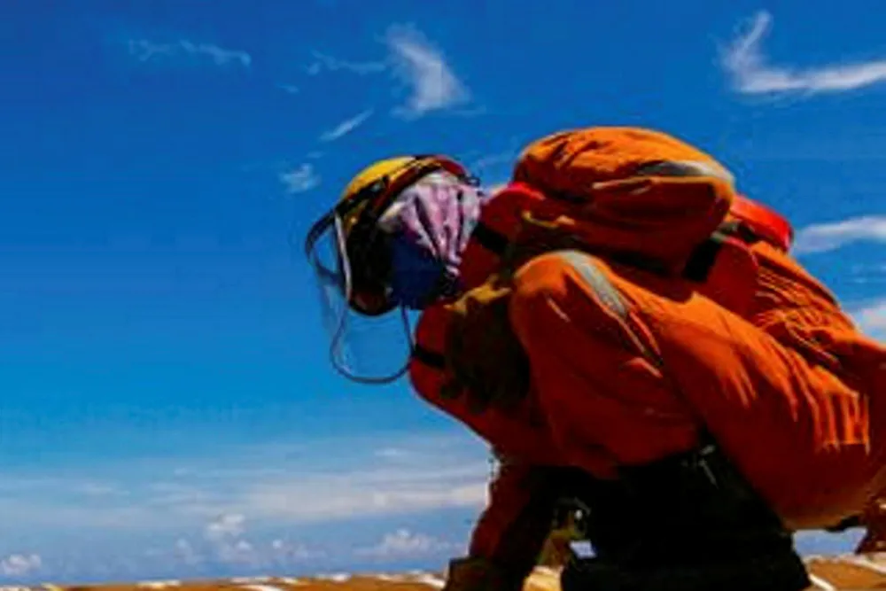 Work halt: Perenco worker braving the sun.