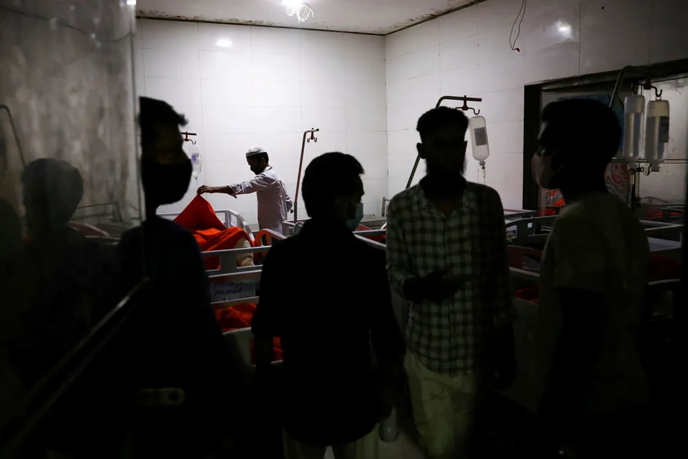 Deadly gas blast: relatives of victims try to identify their bodies at a hospital, after a gas pipeline blast at a mosque in Narayanganj, near Dhaka, Bangladesh