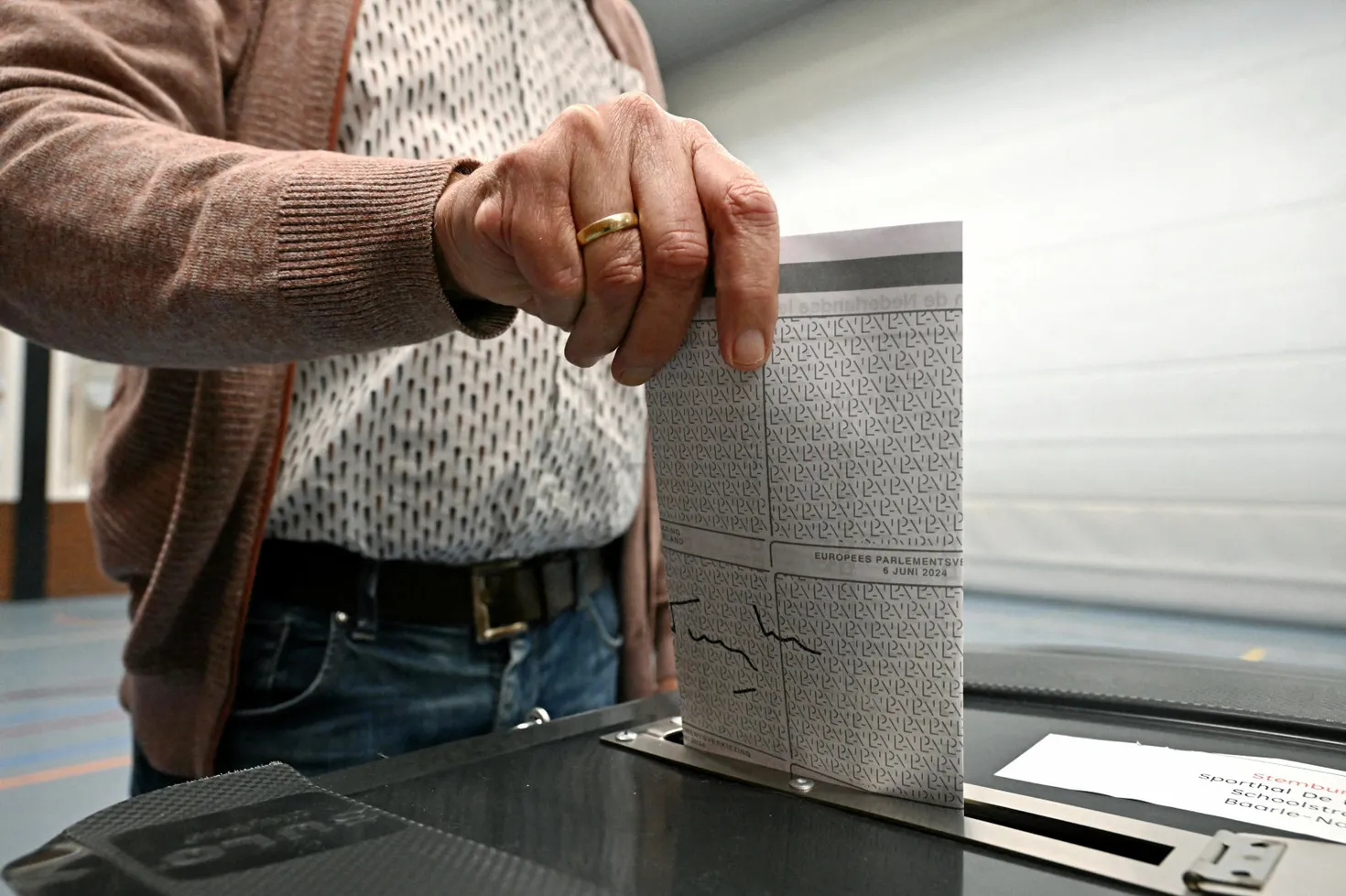 A man casts his ballot for the European elections in a polling station, in Baarle-Nassau, south of Netherlands, on June 6, 2024, on the first day of European Parliament election.