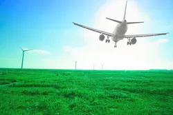 Rendering of an airplane over a wind farm.